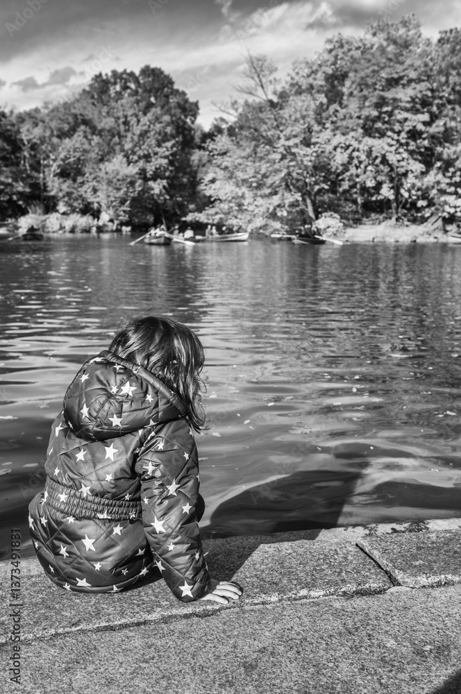 Autumn in Central Park, A Young Girl Walking Amidst Vibrant Foliage