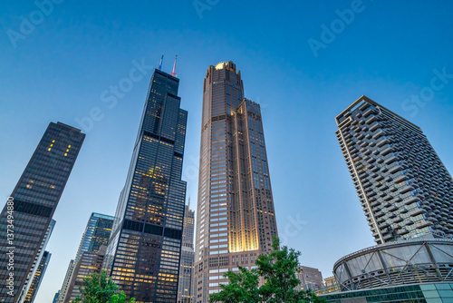 Amazing sunset view of Downtown Chicago skyscrapers from a cruise along the city river