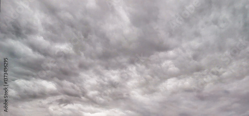 Obraz na płótnie Aerial perspective of a turbulent sky filled with storm clouds, taken by drone w salonie