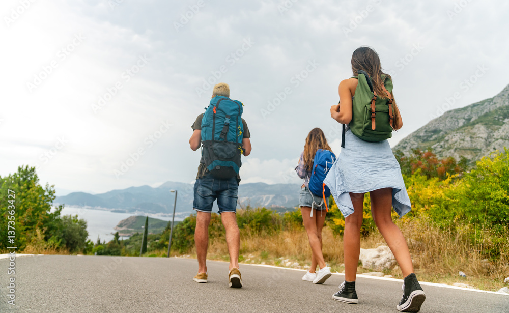 Friendship, travel, vacation, summer and people concept. Group of smiling friends with map traveling