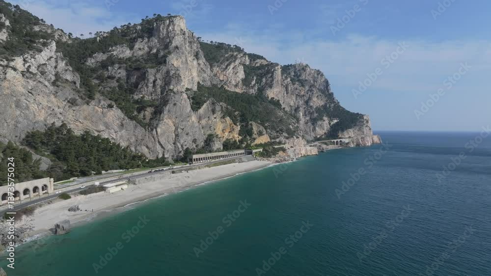 natural cliffs near the beaches and highway near Spiaggia del Malpasso on the road to Southern France from Italy natural cliffs near the beaches and highway near Spiaggia del Malpasso on the road to Southern France from Italy