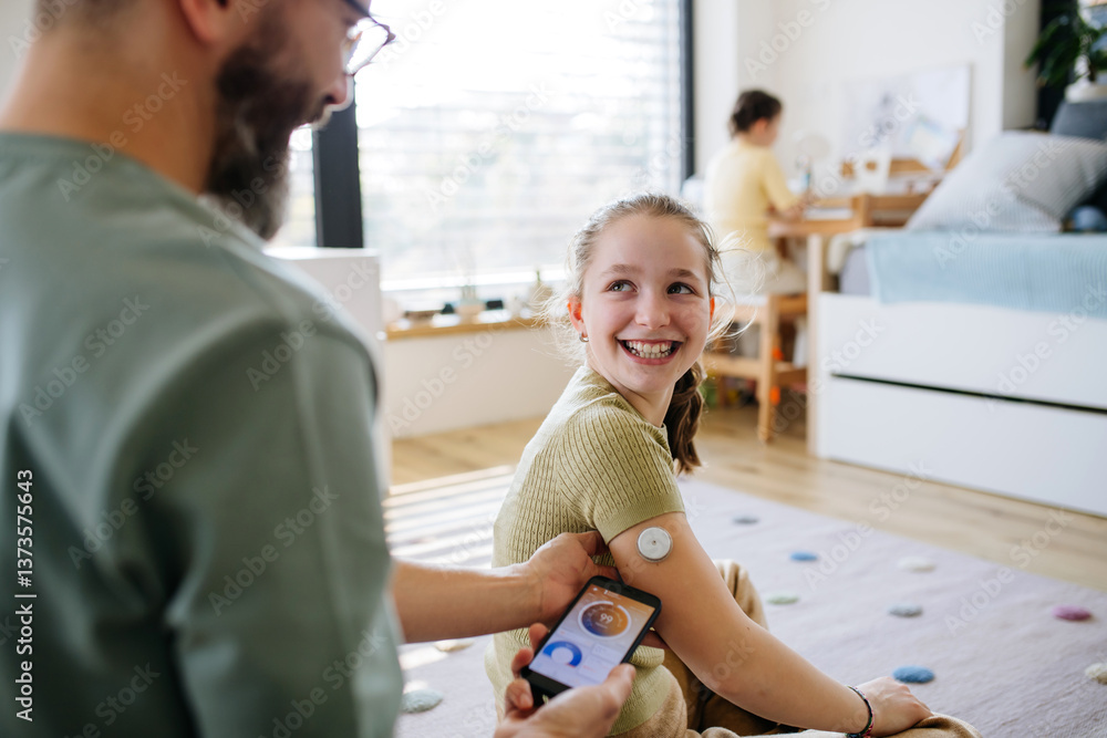 Diabetic girl with a CGM sensor on her arm. Diabetic girl with a CGM sensor on her arm.