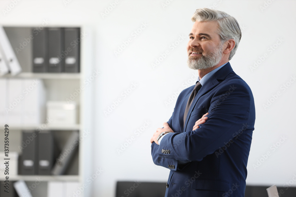 Portrait of banker with crossed arms in office, space for text Portrait of banker with crossed arms in office, space for text