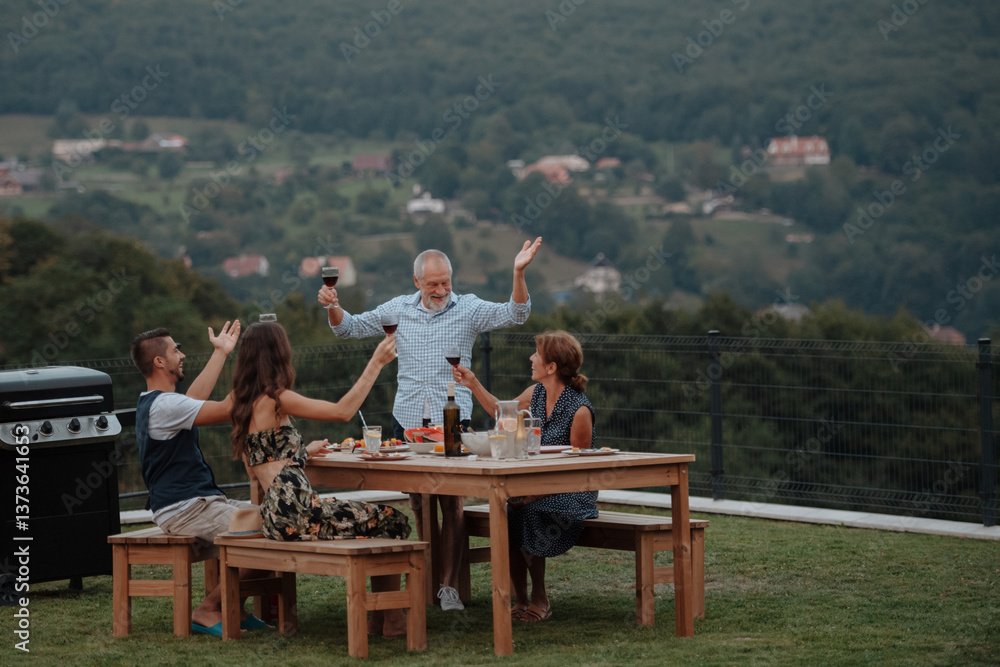Fototapeta premium Family spending time together during spring family barbecue.