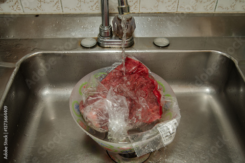 Defrosting. Thawing a piece of beef under running tap water breaks the cold chain. Improper defrosting can increase the risk of bacterial contamination and compromise its safety and quality.