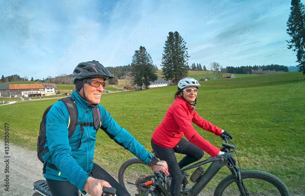Fototapeta premium nice senior couple cycling in spring and having fun