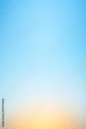 Soft gradient sky transitions from blue to warm orange, evoking