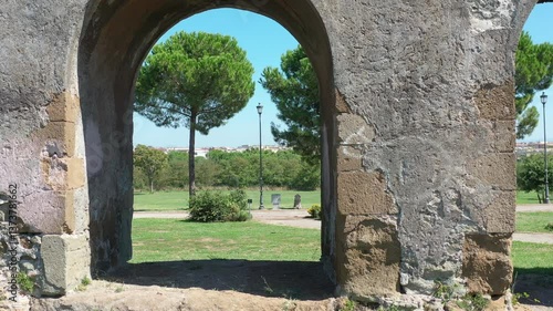 walking in a park in Rome where the Roman aqueducts are located