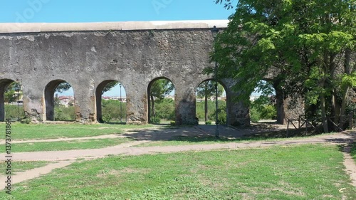 walking in a park in Rome where the Roman aqueducts are located