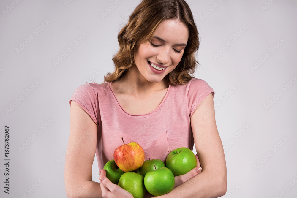 Girl holding green apples, smiling isolated. Girl holding green apples, smiling isolated.