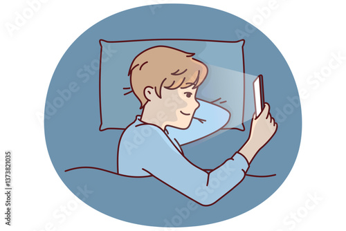 Boy with phone licks in bed and watches movie with smile or plays game refusing to sleep. Kid spends free time using phone at night due to lack of parental control applications on gadget