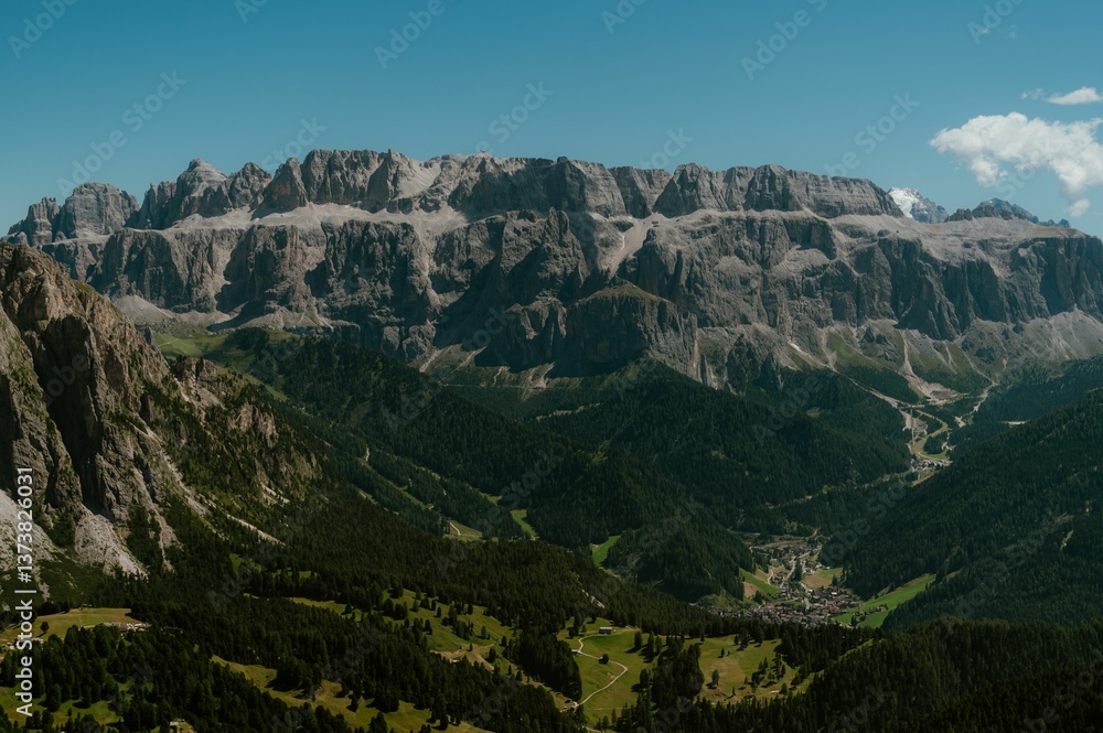 Obraz premium Dolomites mountain range with green valleys.