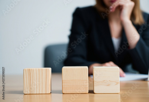There are three wooden cubes lined up.
Wooden Blocks and Business Decision-Making.