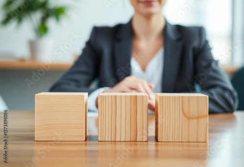 There are three wooden cubes lined up.
Wooden Blocks and Business Decision-Making.