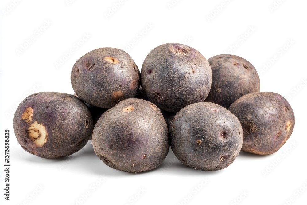 Pile of Dark Purple Potatoes on White Background for Healthy Eating Pile of Dark Purple Potatoes on White Background for Healthy Eating
