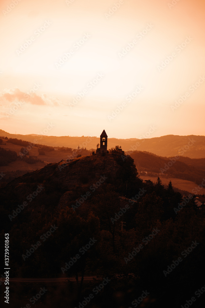 Fototapeta premium church in sunset in the mountains