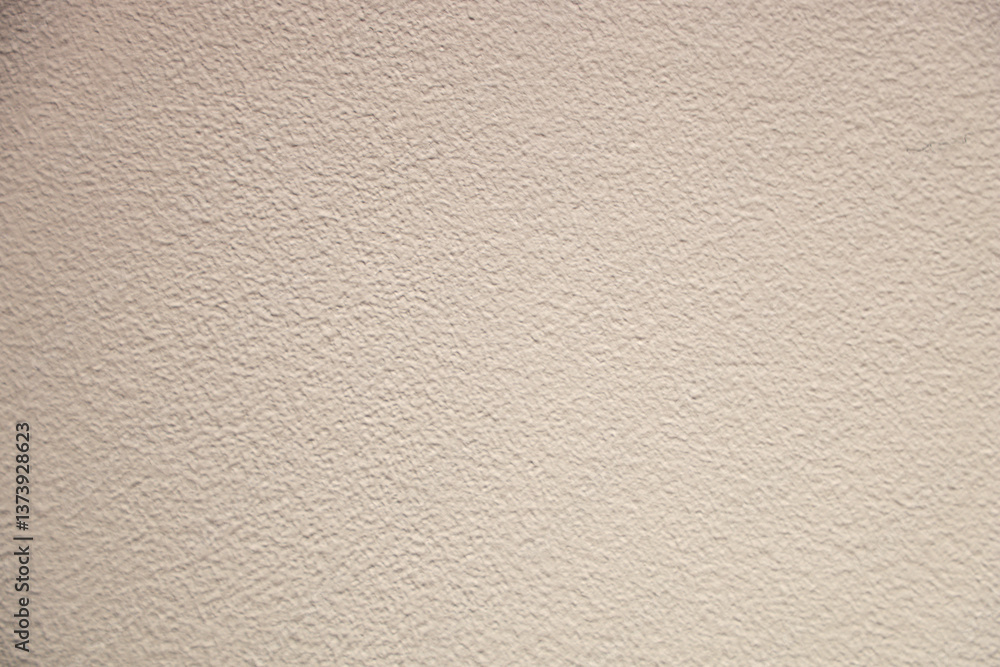 Obraz premium Close-up of a uniform textured pattern wall with a plaster surface.