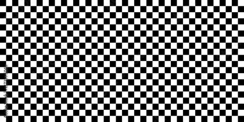 Seamless black and white checkerboard pattern. Classic geometric design useful for backgrounds, textures, textiles, or optical illusion effects. Vector illustration