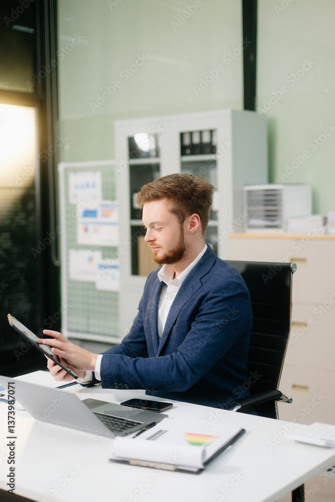 businessman working at office with laptop, tablet, and notes. Perfect for business, finance businessman working at office with laptop, tablet, and notes. Perfect for business, finance