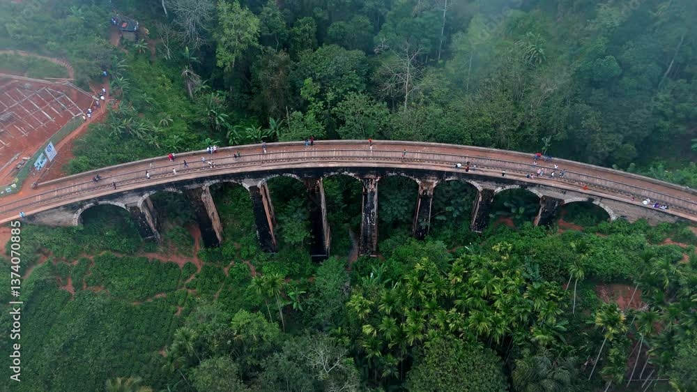 Experience the enchanting beauty of Ella, Sri Lanka with this breathtaking aerial drone footage capturing the iconic Nine Arches Bridge on a misty day. Experience the enchanting beauty of Ella, Sri Lanka with this breathtaking aerial drone footage capturing the iconic Nine Arches Bridge on a misty day.
