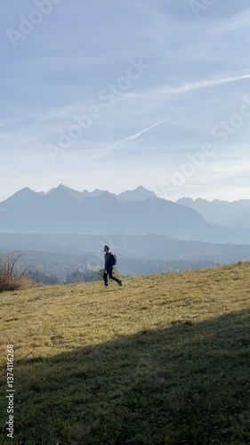 Person Hiking in Mountain Landscape