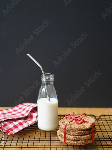 stack of cookies and bottle of milk