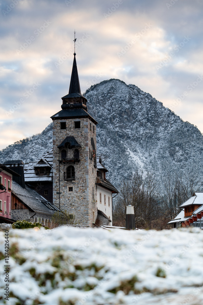 Tarvisio, Italy. Winter in Italy. Julian Alps against the background of the church. Tarvisio, Italy. Winter in Italy. Julian Alps against the background of the church.