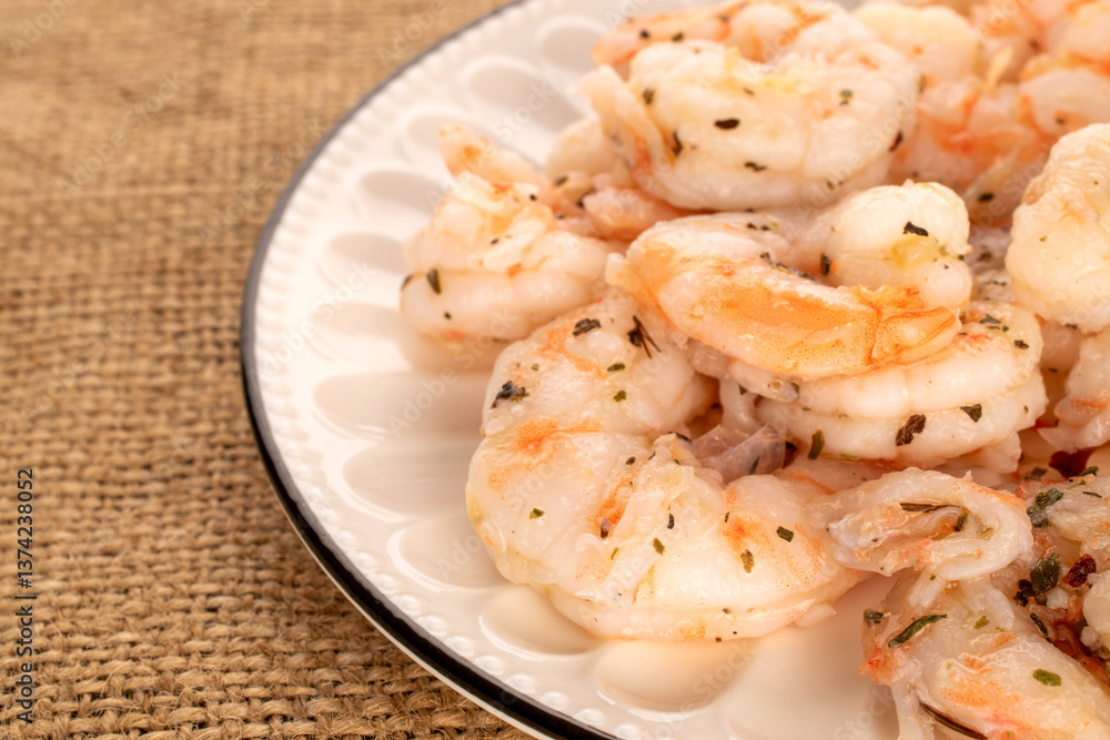 Seafood salad, shrimp with garlic on jute cloth, macro. Seafood salad, shrimp with garlic on jute cloth, macro.