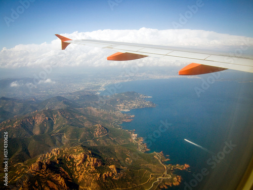 The view from a jetplane window passing over the island of Corsica in the mediterranean and about to land