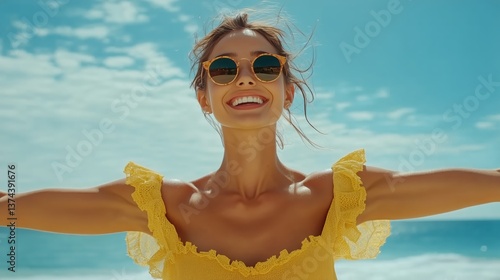 Woman in Yellow Dress Enjoying Sunny Beach Day With Arms Wide Open