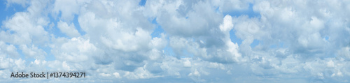 Panorama of beautiful cumulus clouds against the blue sky. Massive cumulus cl...