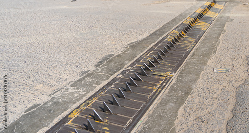 Canvastavla metal spikes in the asphalt, tire spike strip, spike barrier, one-way traffic sp