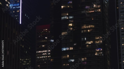 Wallpaper Mural Toronto Downtown At Night, With Office Skyscrapers Shining Brightly. The Lights In The Office Buildings Reflect The City Dynamic Economy And Thriving Business Environment. Torontodigital.ca