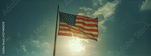 Majestic American Flag Waving Against a Panoramic Mountain Landscape at Sunset