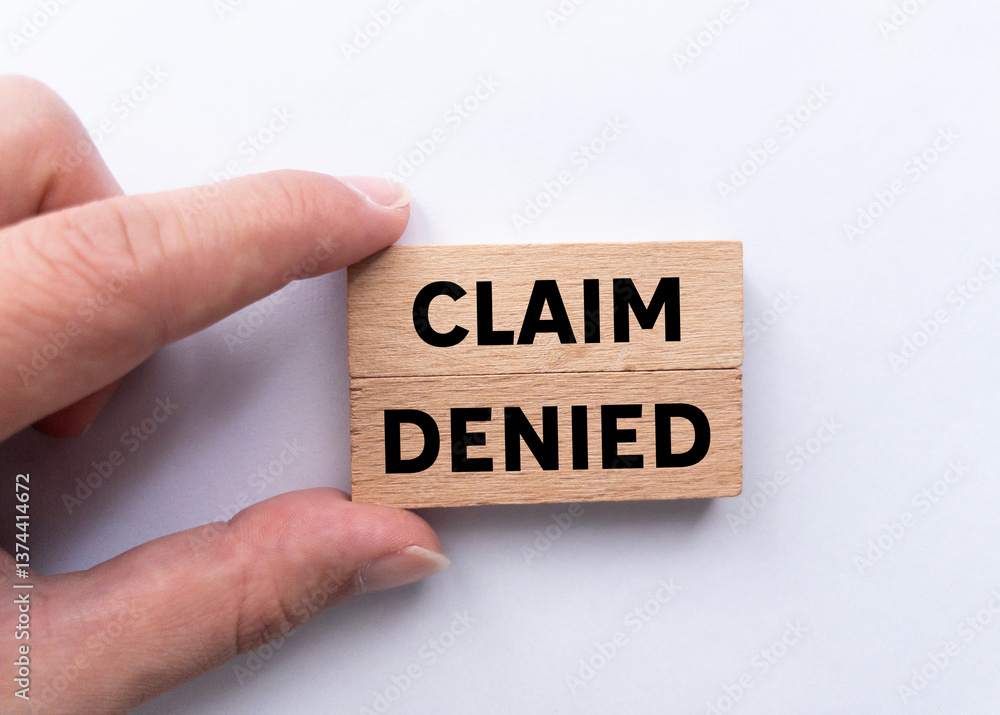 Claim denied message written on wooden blocks on white background. Conceptual claim denied symbol. Copy space. Claim denied message written on wooden blocks on white background. Conceptual claim denied symbol. Copy space.