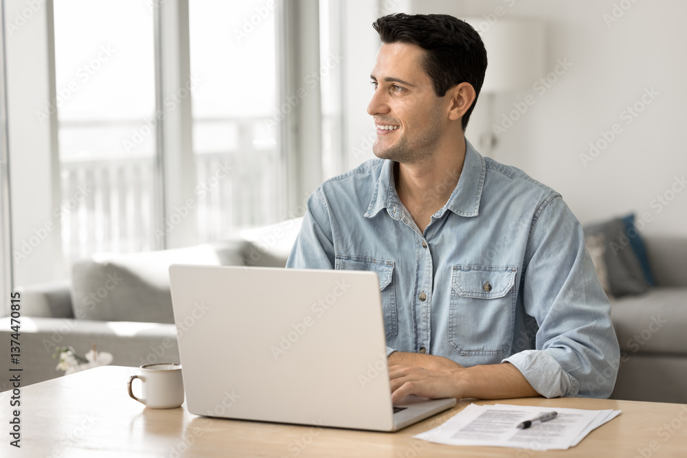 Young man sit at desk with laptop, looking away, engaged in remote work or creative tasks completion, smile, feel satisfied with work result, think about new professional achievements or opportunities Young man sit at desk with laptop, looking away, engaged in remote work or creative tasks completion, smile, feel satisfied with work result, think about new professional achievements or opportunities