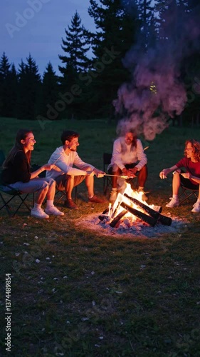 A group of friends gather around a warm campfire at dusk, roasting marshmallows and sharing stories in a forested area
