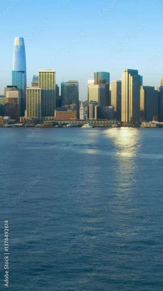 Amazing aerial view of San Francisco skyline. Flyover the Pacific ocean with several ships. Famous skyscrapers over a blue sky. Shot in 8K. California, United States. Amazing aerial view of San Francisco skyline. Flyover the Pacific ocean with several ships. Famous skyscrapers over a blue sky. Shot in 8K. California, United States.