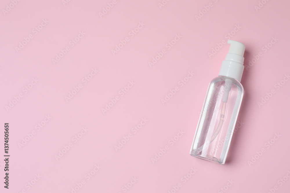 Natural cosmetic products. Cosmetic bottle on a pink background, top view Natural cosmetic products. Cosmetic bottle on a pink background, top view