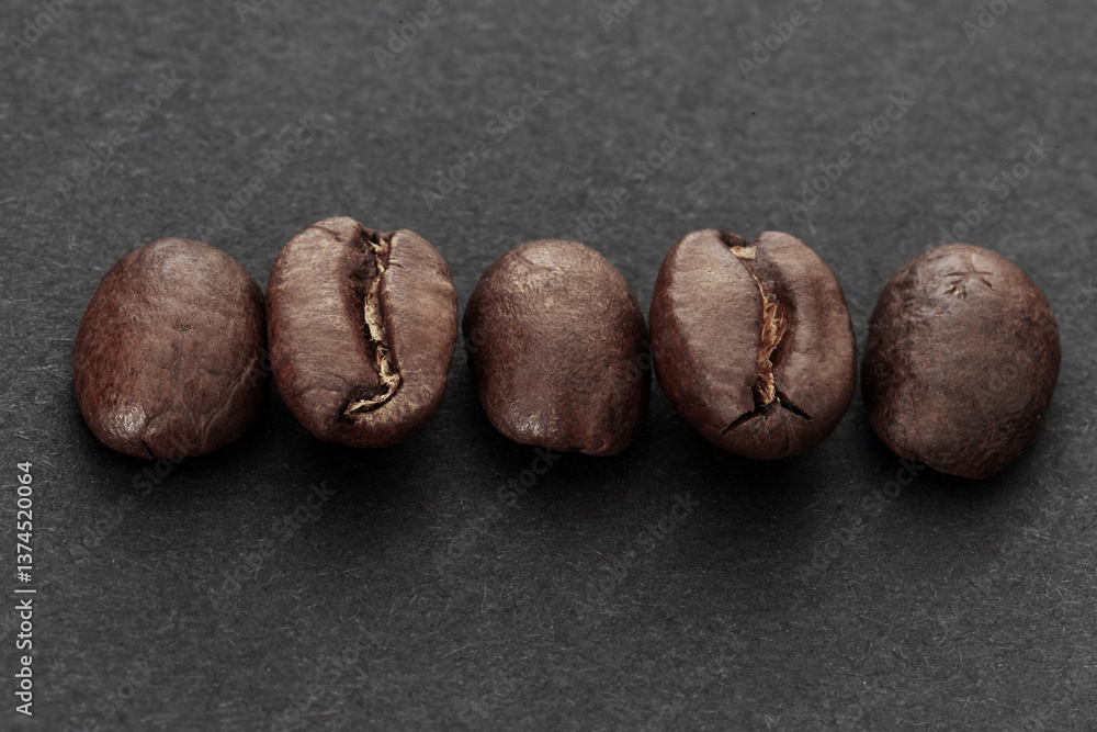 Close-Up of Raw Coffee Beans on Dark Background