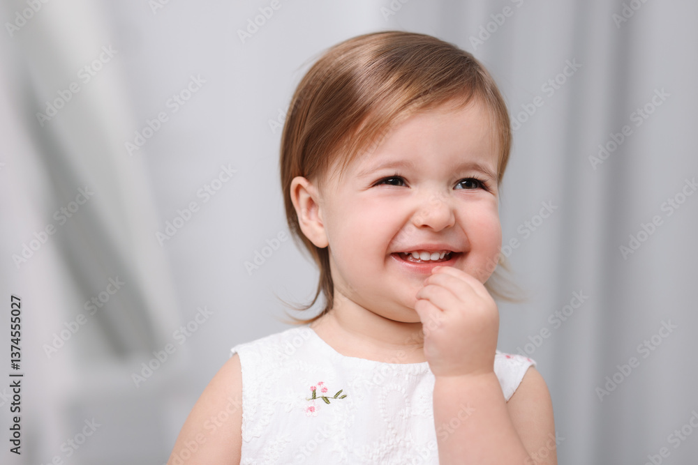 Cute little baby girl on light grey background Cute little baby girl on light grey background