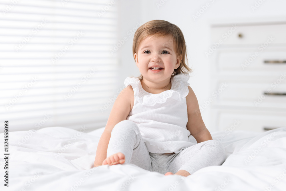 Cute little baby girl on bed at home Cute little baby girl on bed at home