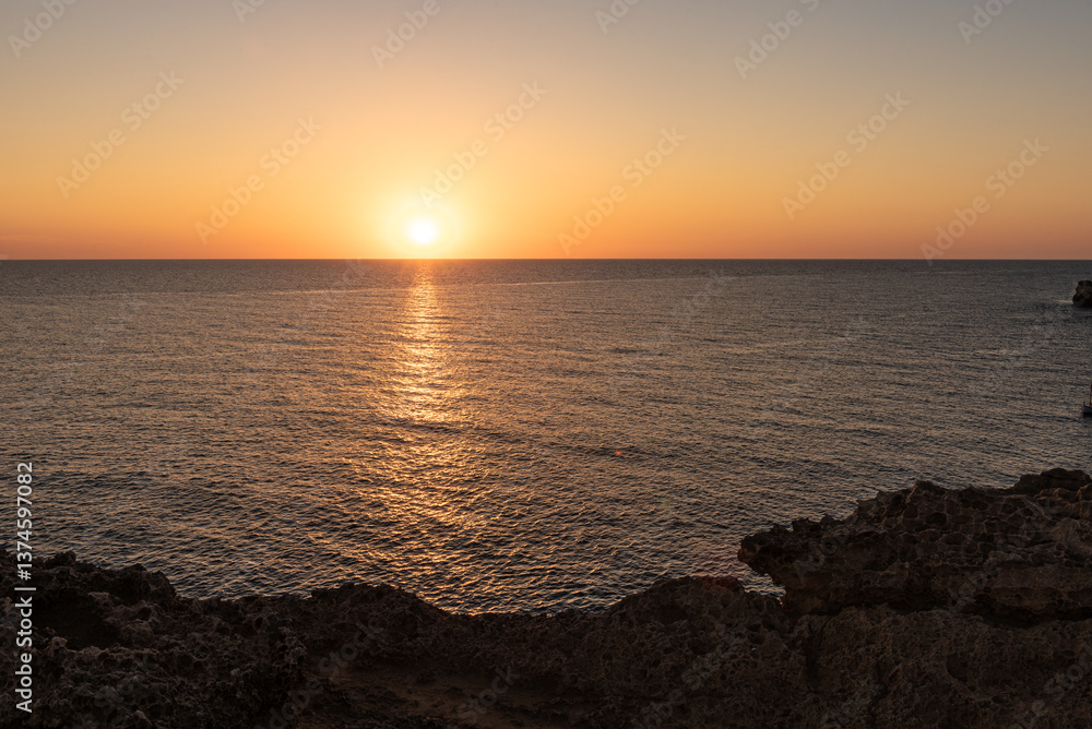 The serene sea at dawn or dusk, with calm, tranquil waters. The serene sea at dawn or dusk, with calm, tranquil waters.