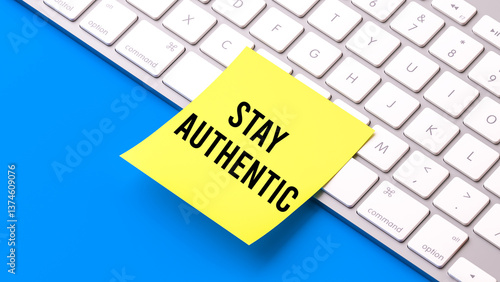 Stay authentic text message, sticky note on computer keyborad