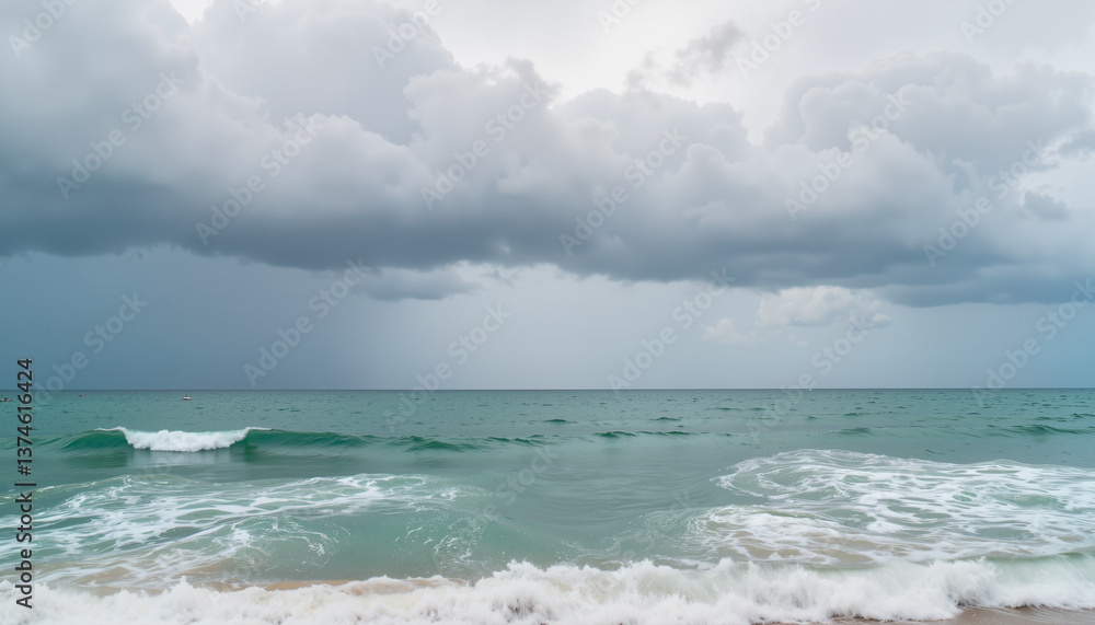 Ocean waves crashing under dramatic cloudy sky Ocean waves crashing under dramatic cloudy sky