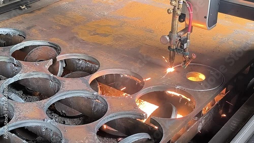 Gas cutting and welding of metal on a CNC machine.