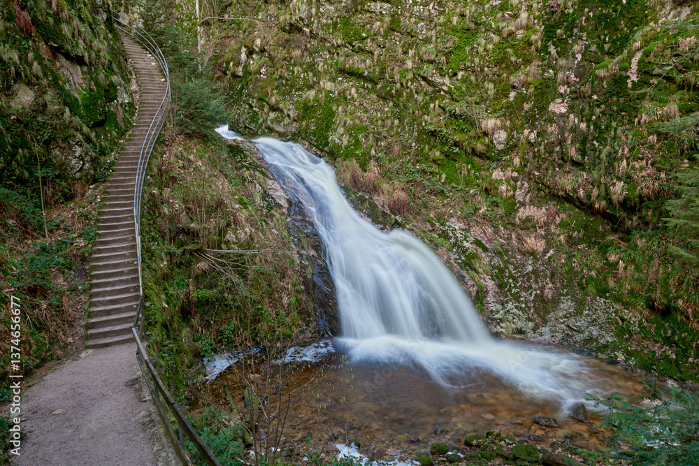Naklejka premium Majestic Allerheiligen Waterfalls: Powerful Cascades Over Mossy Rocks in Black Forest National Park's Pristine Wilderness