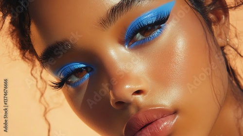 a person with vibrant blue eye makeup
