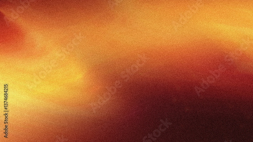 Abstract blurred background with warm colors showing a blend of orange yellow and red tones softly diffused