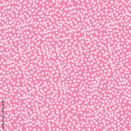 Seamless pattern of white dots on pink background